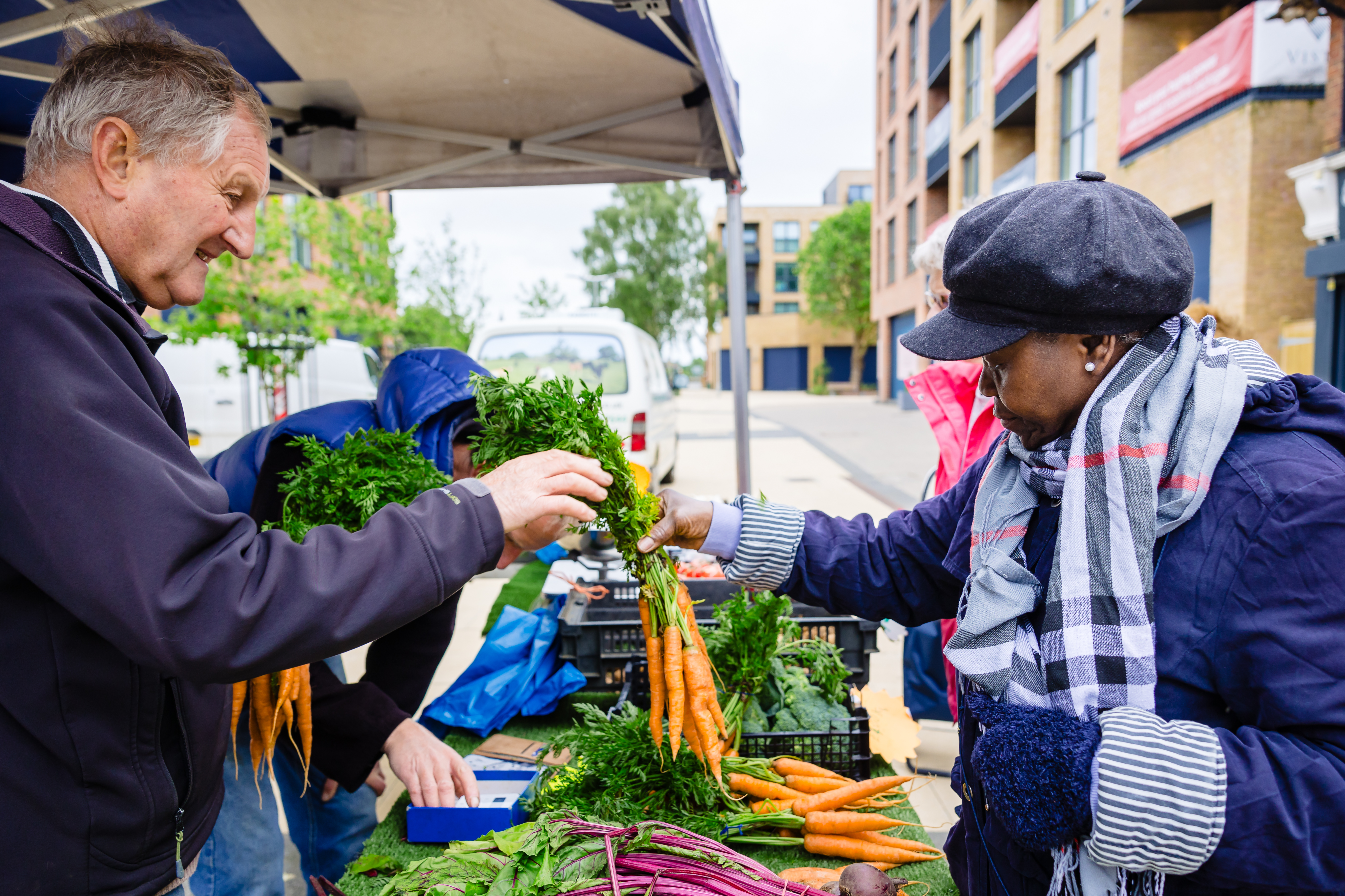 man giving lady carrots