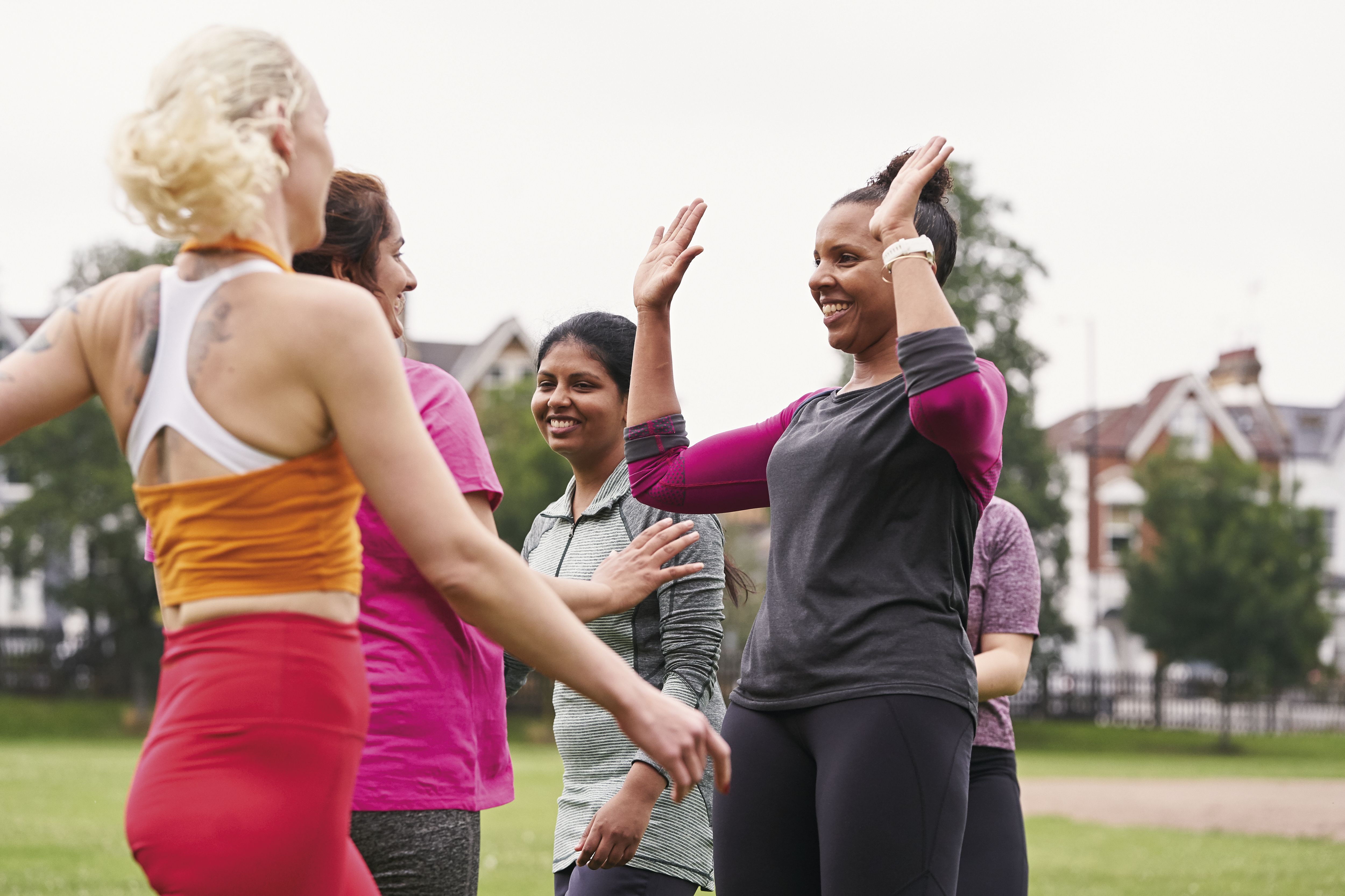 women high-fiving