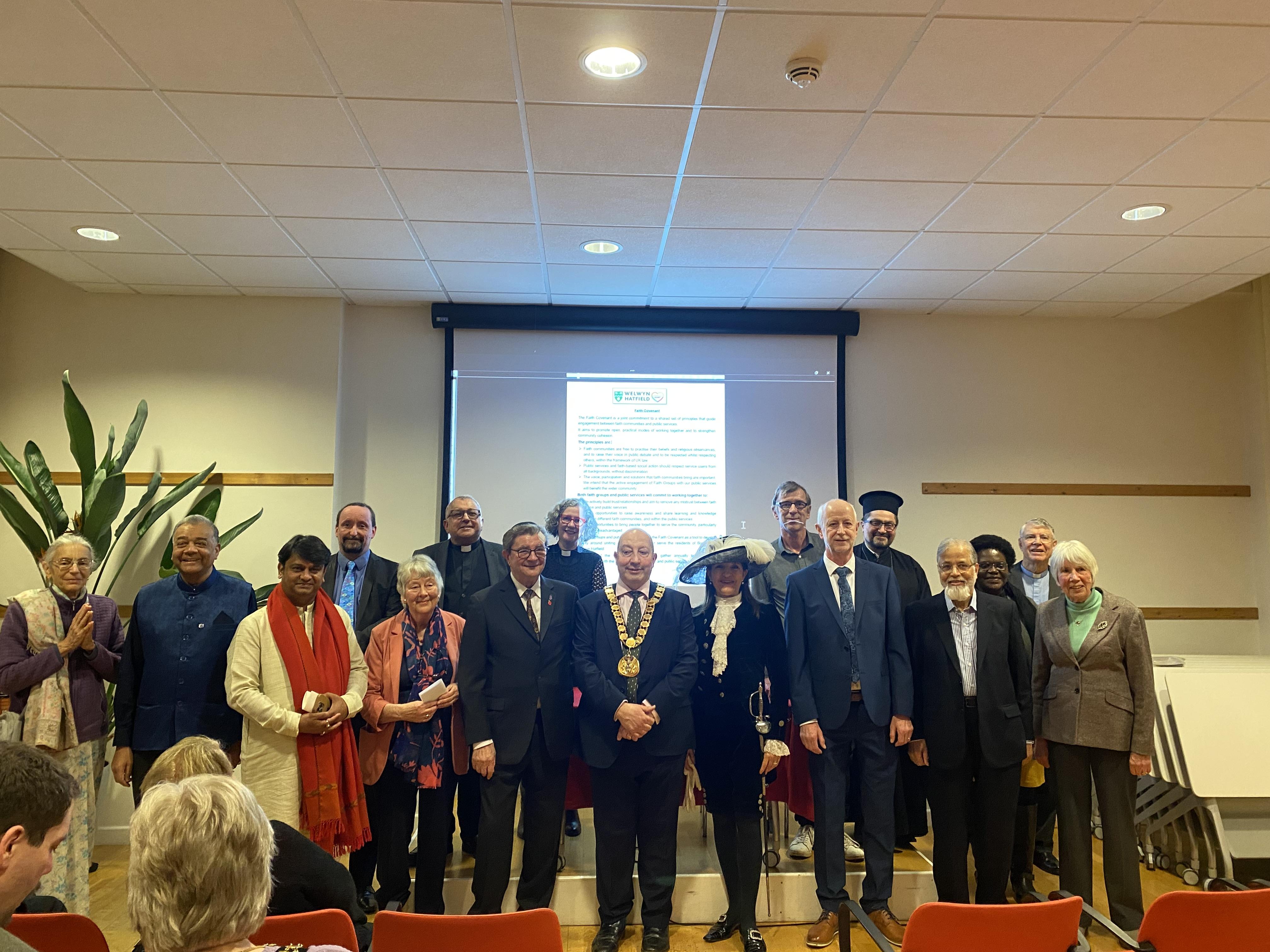 The mayor and local faith leaders at the covenant signing