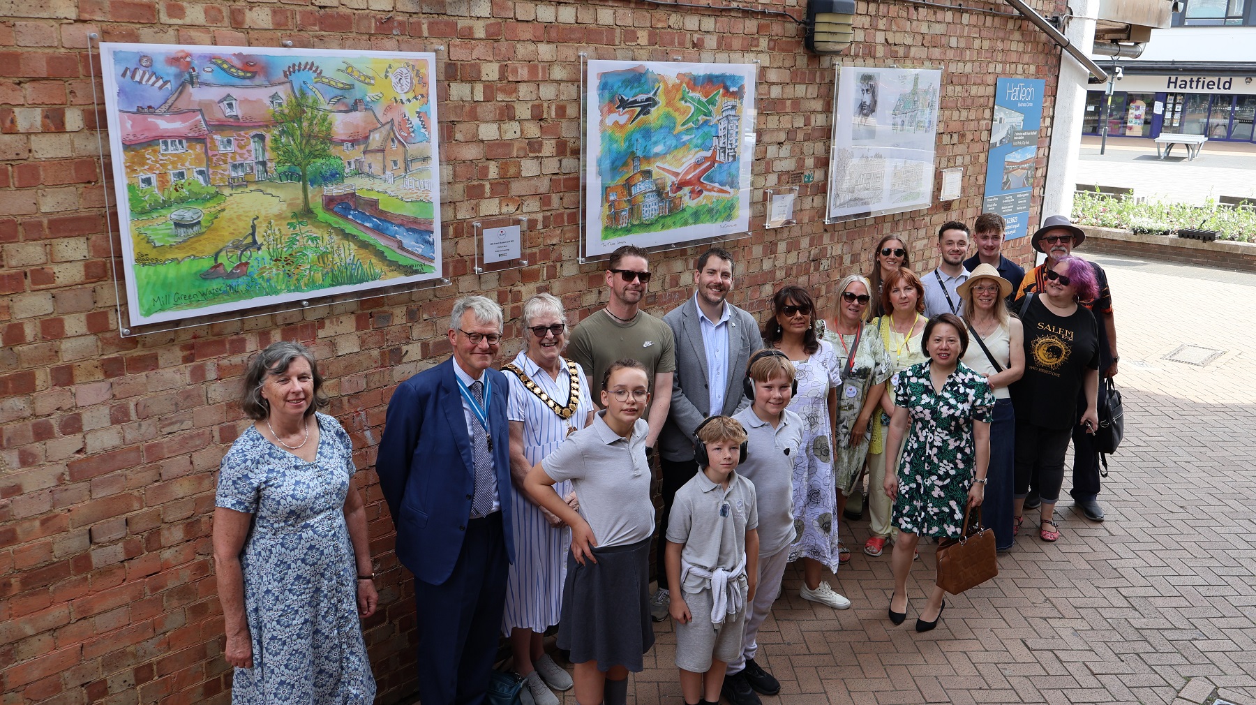 People standing in front of artwork