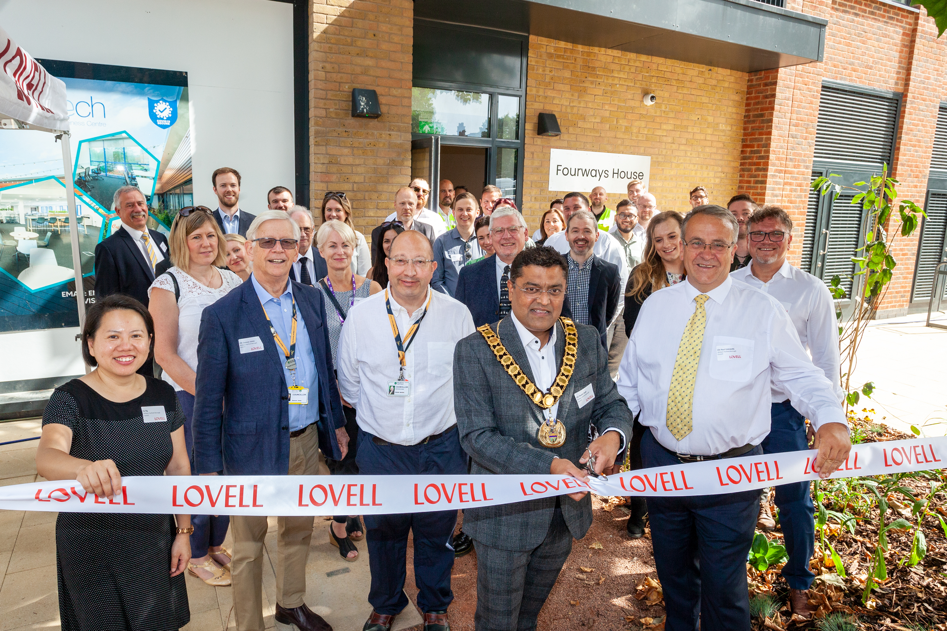 Councillors and staff from WHBC cutting a ribbon at ONE Town Centre