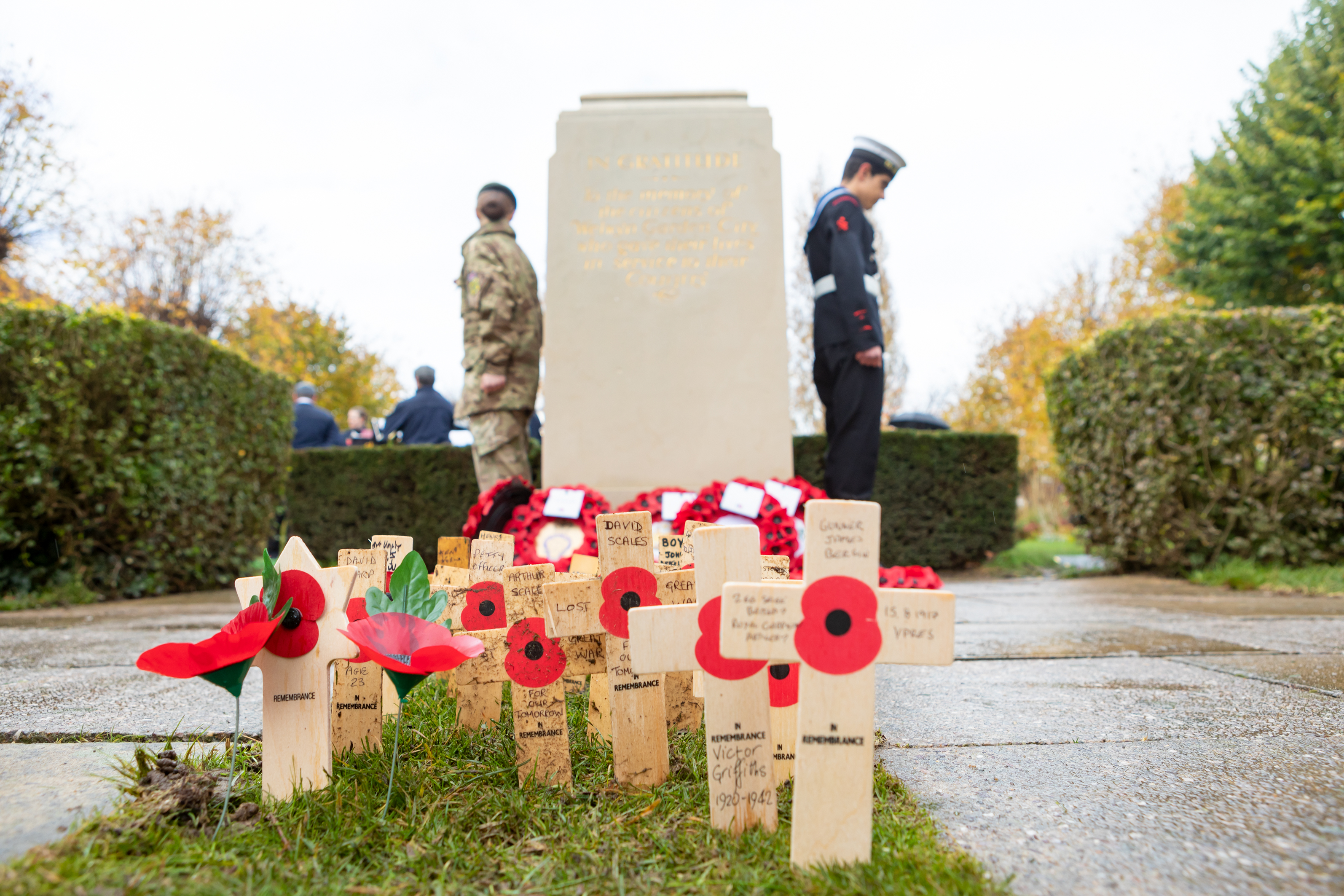 Two cadets at the memorial with poppies 2