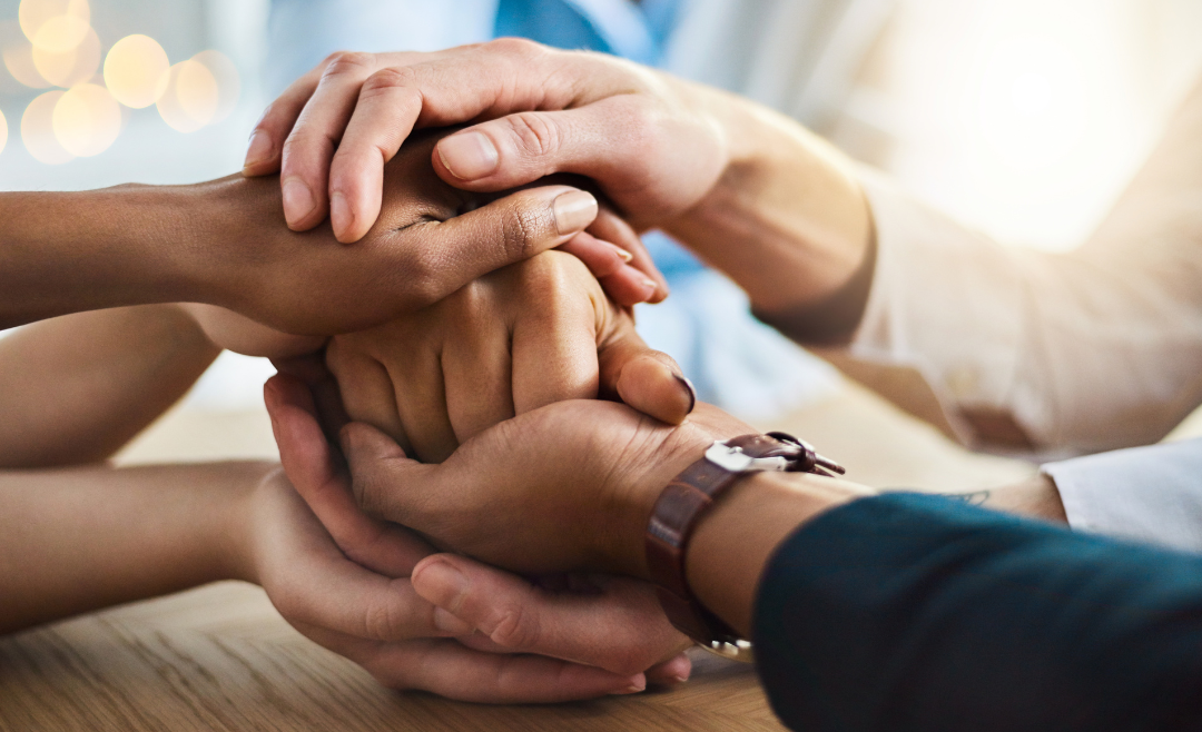 People holding each others hands