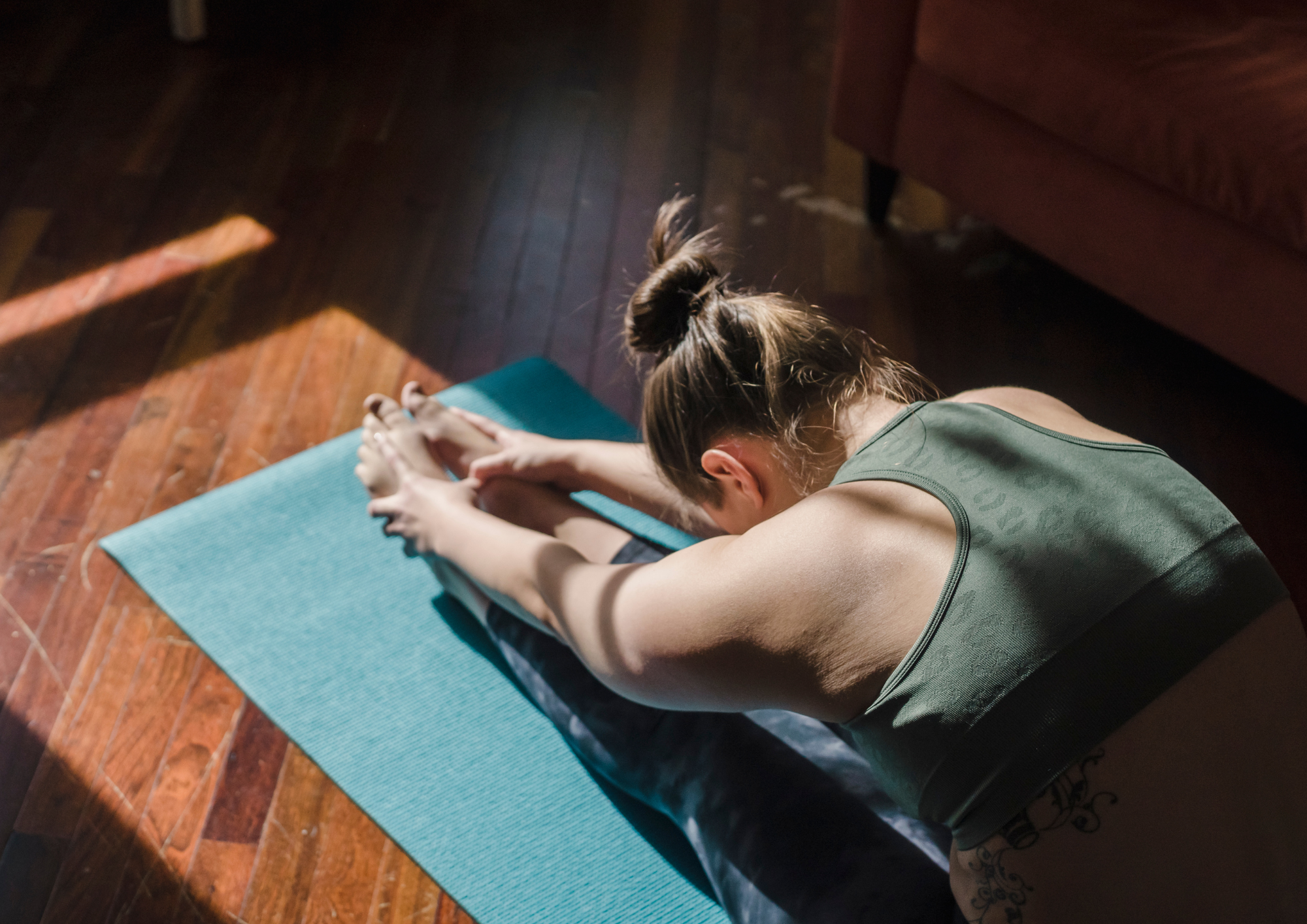 woman stretching on a yoga mat.