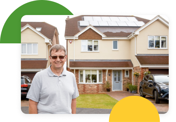 man outside his house that has solar panneling