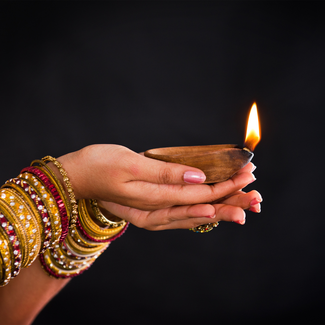 Hands holding candle