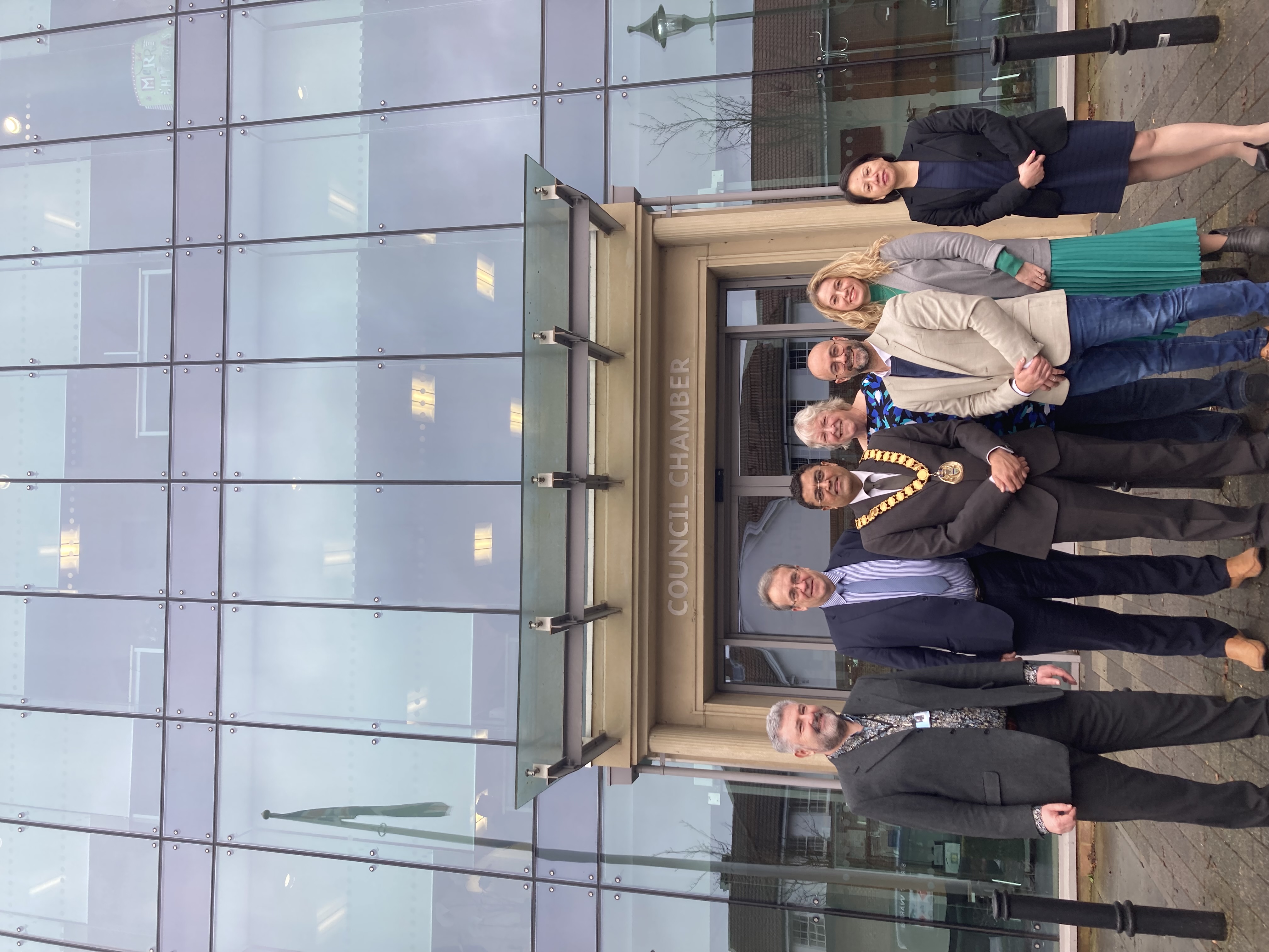 Cllrs and staff members with Wenta staff members outside the council office.
